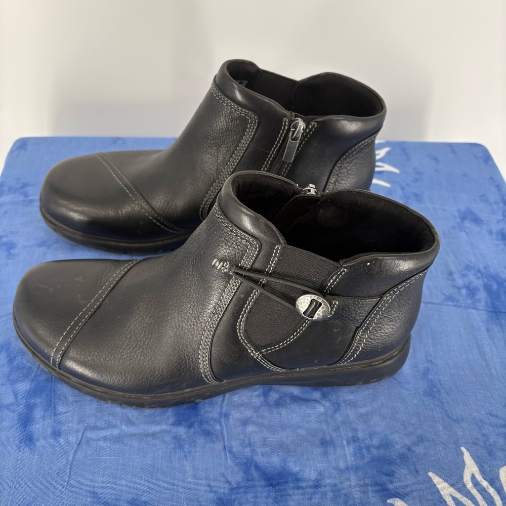 Clarks Black Leather Ankle Boots with Buckle and featuring zipper. Size 9.